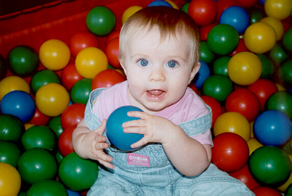 [Anna in a ball pit at Chuck E. Cheese's - Fall 2000]