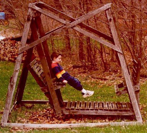 [Joshua on wooden swing - Easter 2000]